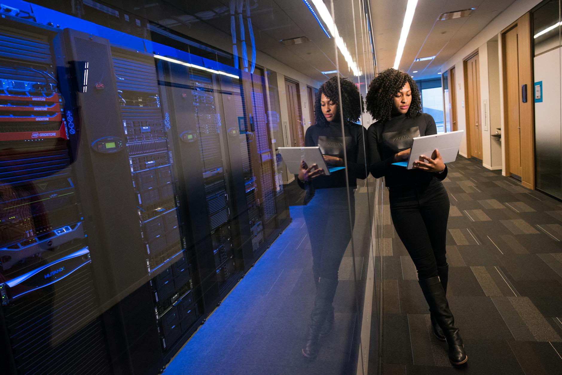 Pexels: Compliance officer reviewing audit evidence and logs on multiple monitors